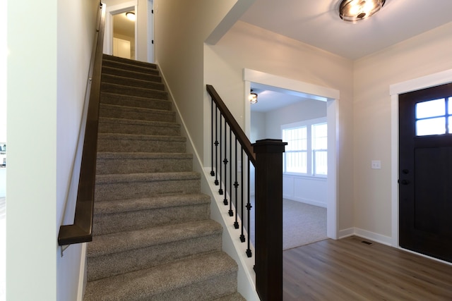 entryway with hardwood / wood-style floors