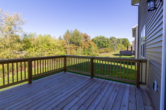 wooden terrace with a yard