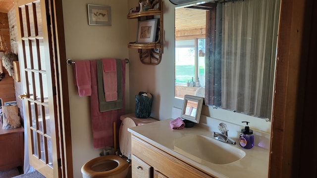 bathroom with vanity and toilet