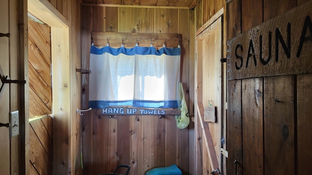 interior space featuring wood walls