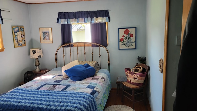 bedroom with dark wood-type flooring