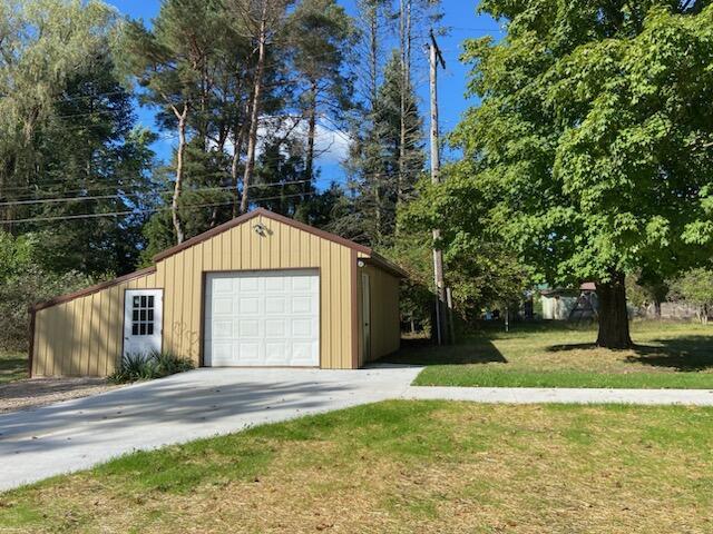 garage with a yard