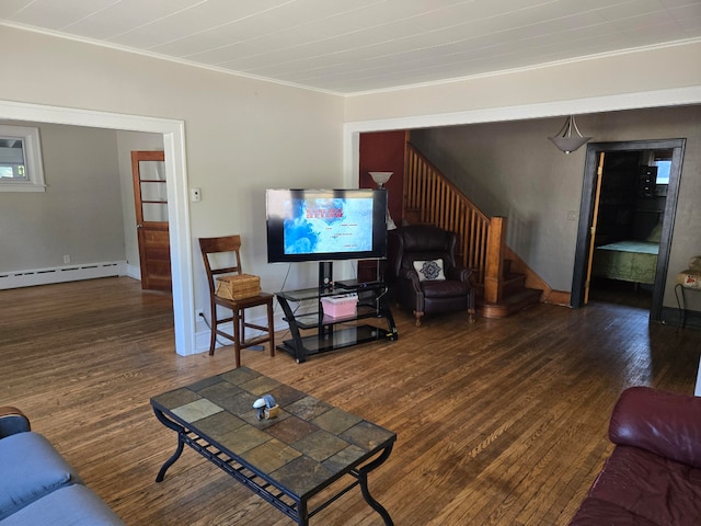 living room with crown molding, dark hardwood / wood-style flooring, and a baseboard heating unit