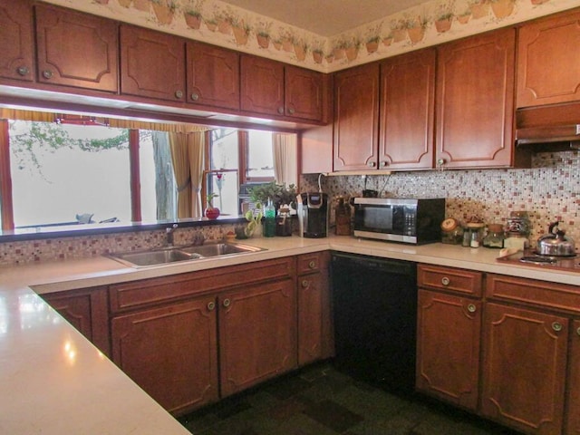 kitchen featuring appliances with stainless steel finishes, backsplash, and sink