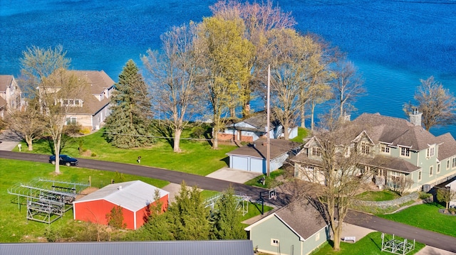 aerial view featuring a water view and a residential view