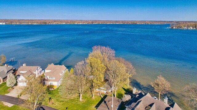 bird's eye view featuring a water view and a residential view