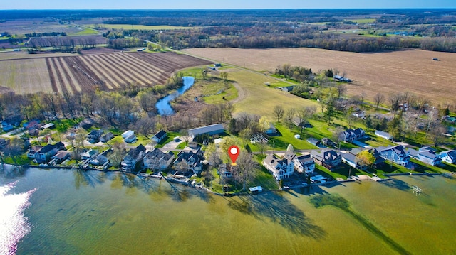 bird's eye view featuring a water view and a residential view