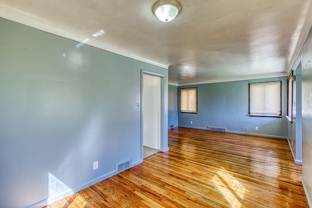 unfurnished room with light hardwood / wood-style floors