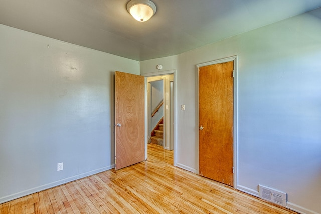 spare room with light wood-type flooring