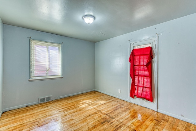 unfurnished room featuring light hardwood / wood-style floors