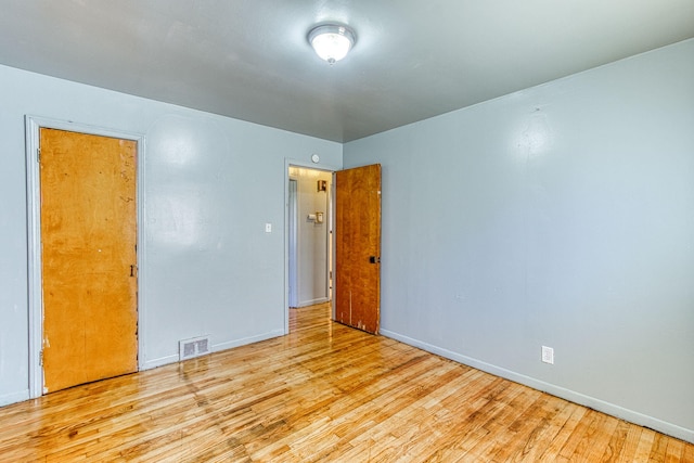 spare room featuring light hardwood / wood-style floors