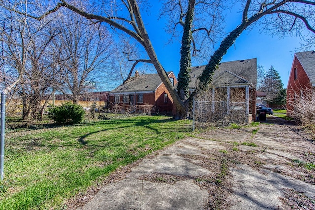 back of house featuring a yard