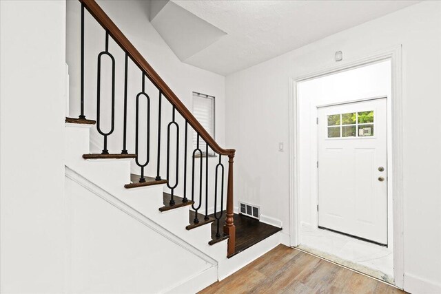 foyer with hardwood / wood-style flooring