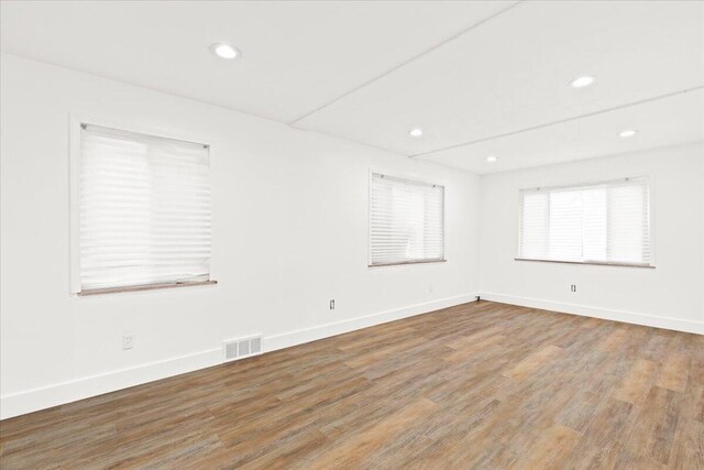 empty room with wood-type flooring