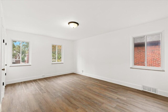 unfurnished room featuring hardwood / wood-style floors