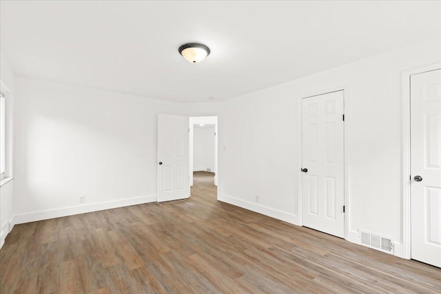 unfurnished room featuring light hardwood / wood-style floors