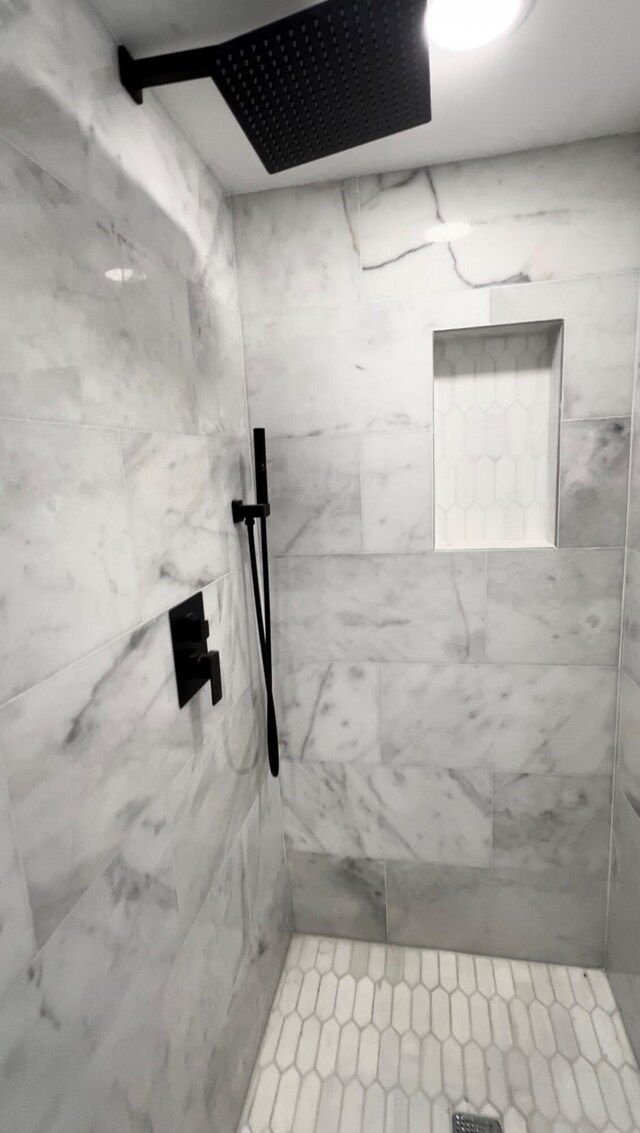 bathroom with tiled shower