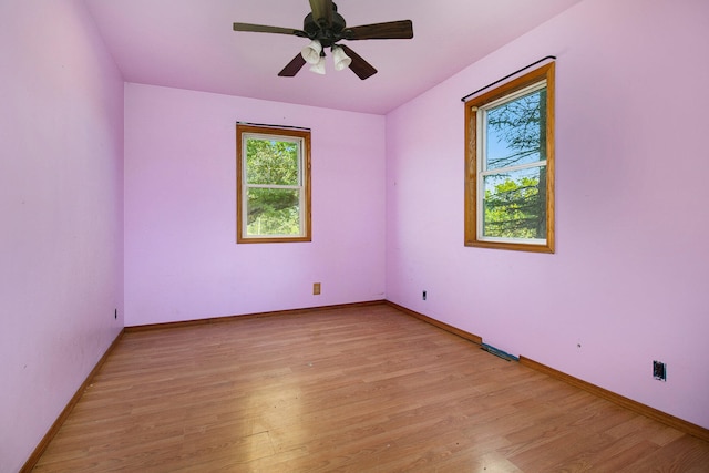 empty room with light wood-type flooring and ceiling fan