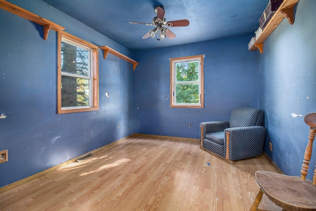 unfurnished room with light hardwood / wood-style flooring and ceiling fan