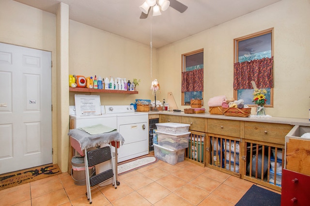 interior space with tile patterned floors, washer and clothes dryer, and ceiling fan