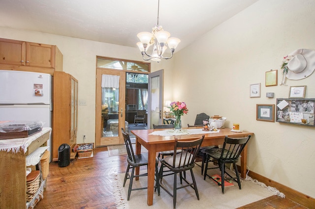 dining area featuring a chandelier and hardwood / wood-style flooring