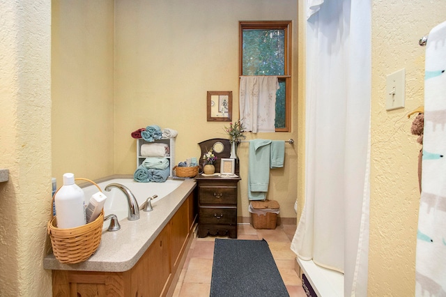 bathroom with tile patterned floors