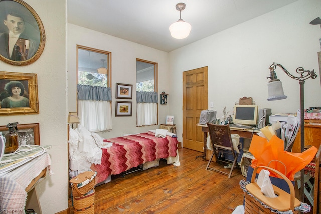 bedroom with hardwood / wood-style floors