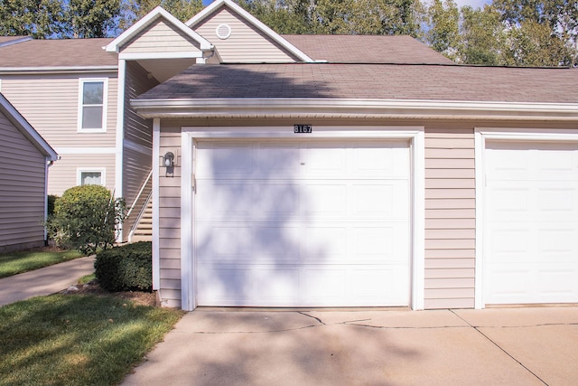 garage featuring wood walls