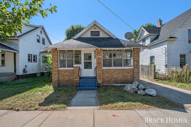 bungalow with a front lawn