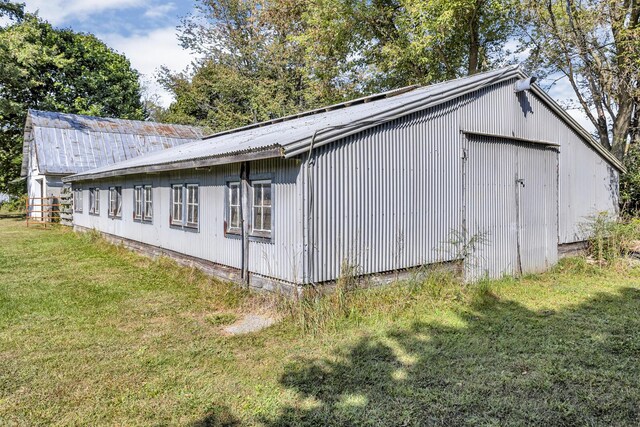 view of property exterior with a yard