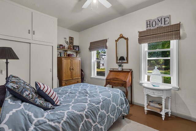 bedroom with ceiling fan and a closet