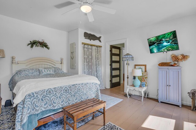 bedroom featuring wood-type flooring and ceiling fan