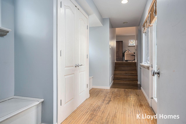 hallway with light hardwood / wood-style flooring