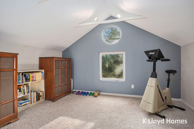 rec room with vaulted ceiling and carpet floors