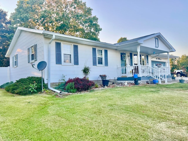 view of front facade with a front lawn and covered porch