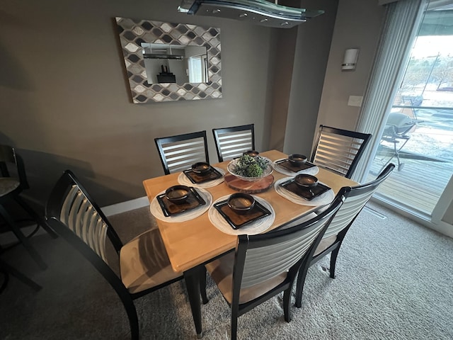 dining space featuring carpet flooring