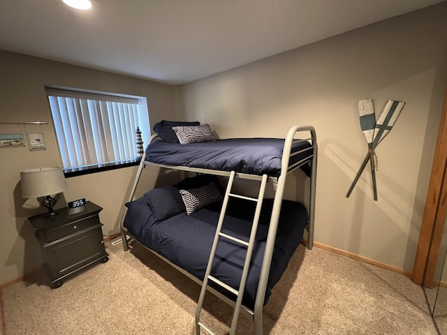 bedroom featuring light colored carpet