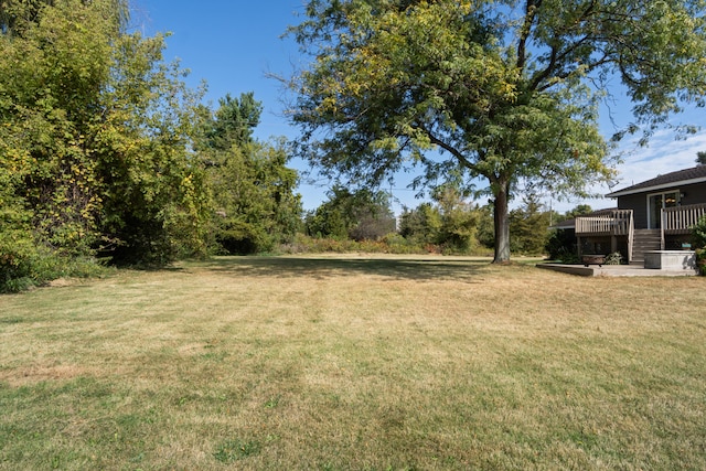 view of yard with a wooden deck