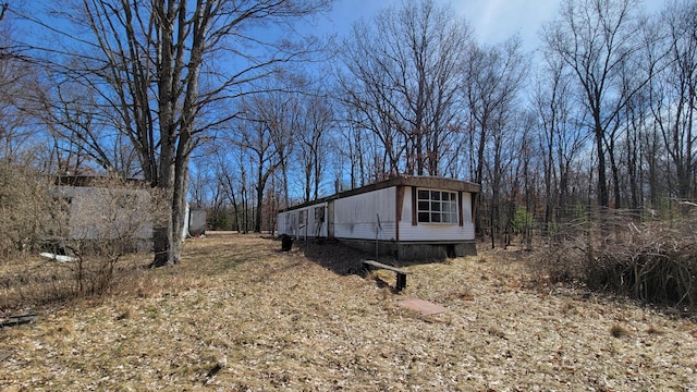 view of home's exterior featuring an outbuilding