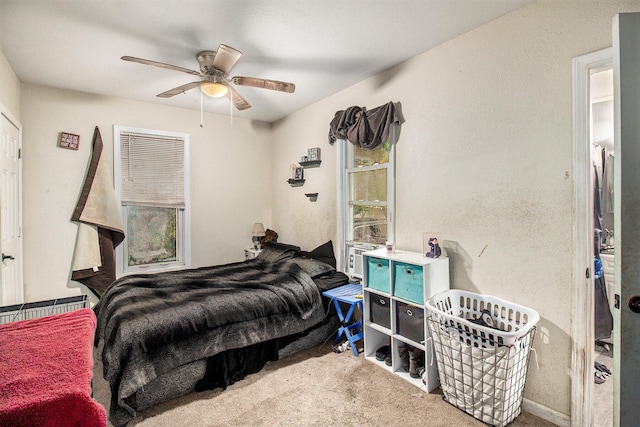 carpeted bedroom with ceiling fan