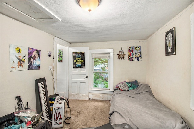 carpeted bedroom with a textured ceiling