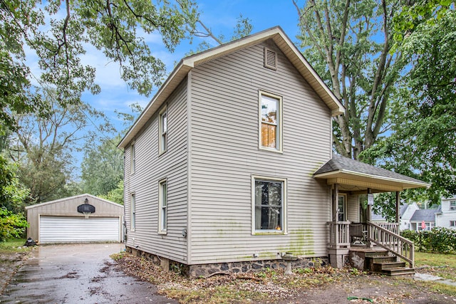 view of front of house with an outdoor structure and a garage