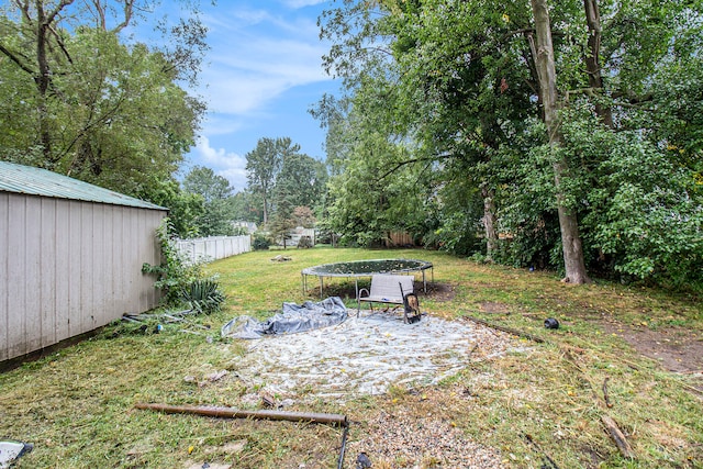 view of yard with a patio and a trampoline