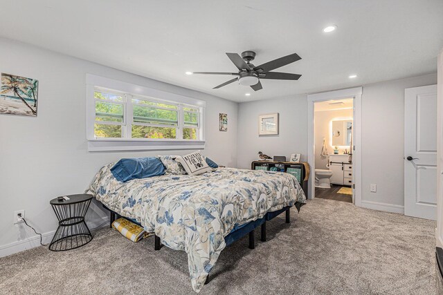 bedroom featuring connected bathroom, carpet flooring, and ceiling fan