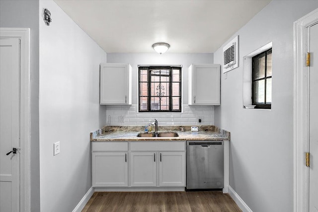 kitchen with dishwasher, white cabinetry, a healthy amount of sunlight, and sink