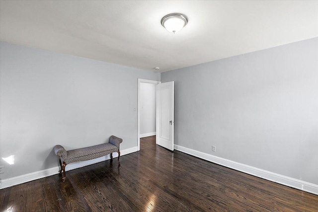 unfurnished room featuring dark hardwood / wood-style flooring