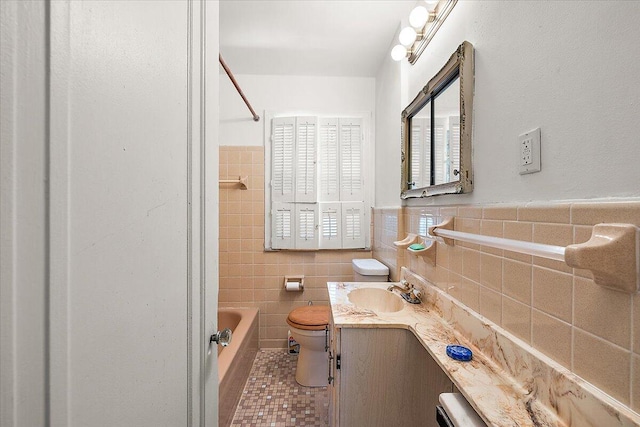 full bathroom with vanity, tile patterned flooring, bathing tub / shower combination, tile walls, and toilet