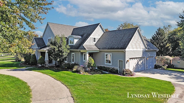 view of front of home featuring a front lawn and a garage