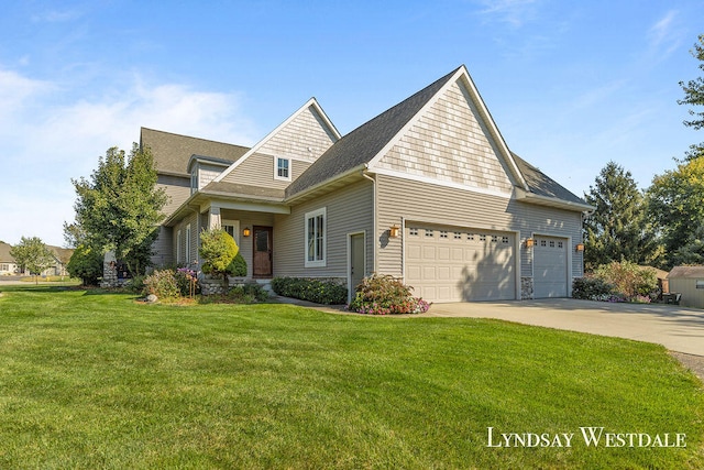 view of front of home featuring a front lawn and a garage