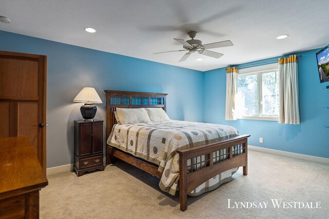 carpeted bedroom featuring ceiling fan